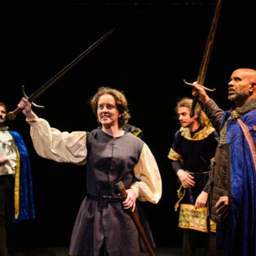 An image of the cast of Saint Joan on stage in costume