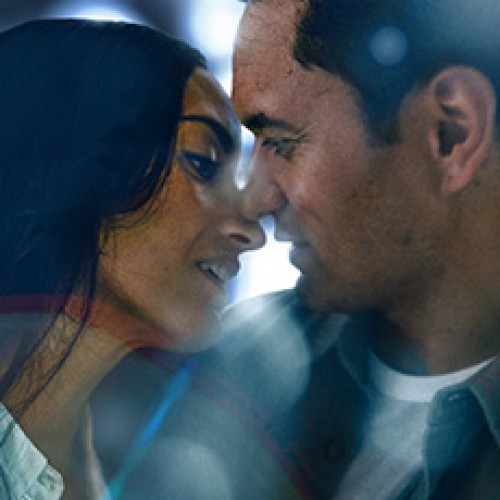 Actors Jarod Rawiri and Renaye Tamati are in blue denim outfits, very close to one another as if about to kiss