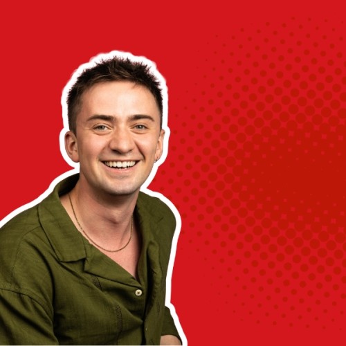 An image of Andrew Tindall agaisnt a red wall